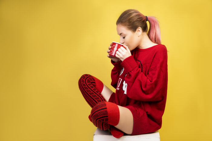 Girl drinking hot coffee